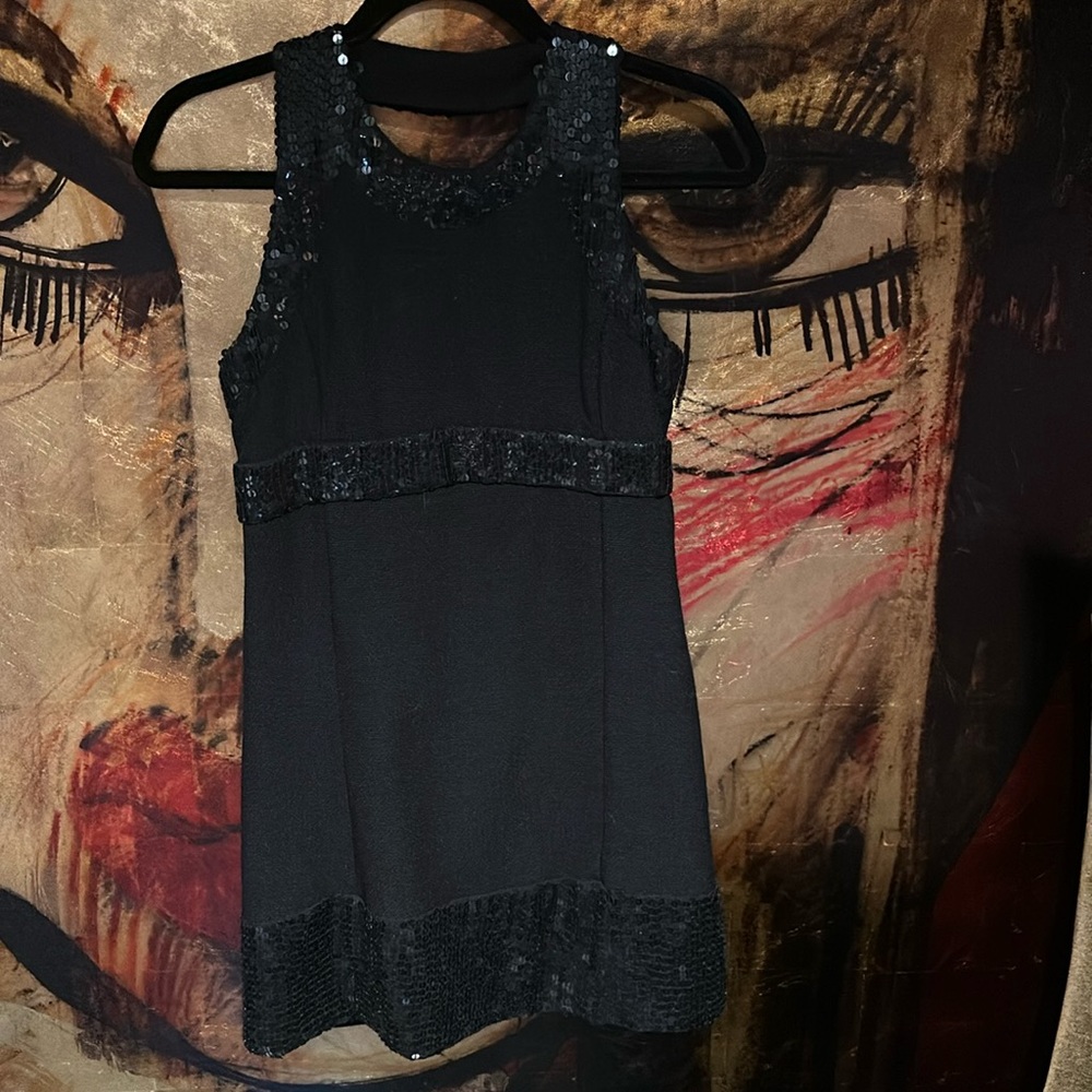 Black mini dress with sequins. Beautifully detailed stunning on